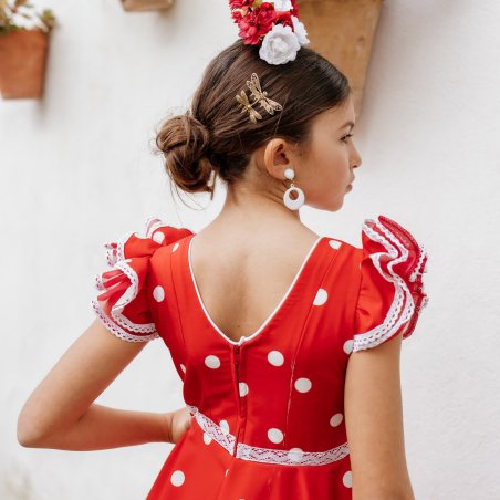 Vista trasera del vestido flamenco de niña con cierre de cremallera y ajuste de escote.